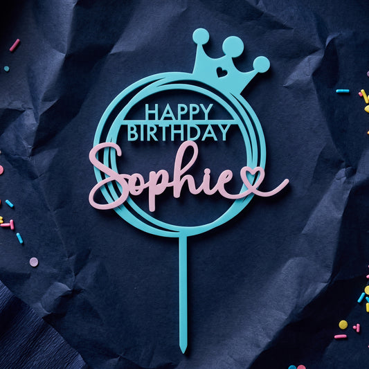 Geburtstag Cake Topper Happy Birthday mit Krone in Türkis und Rosa auf marineblauem Krepppapier