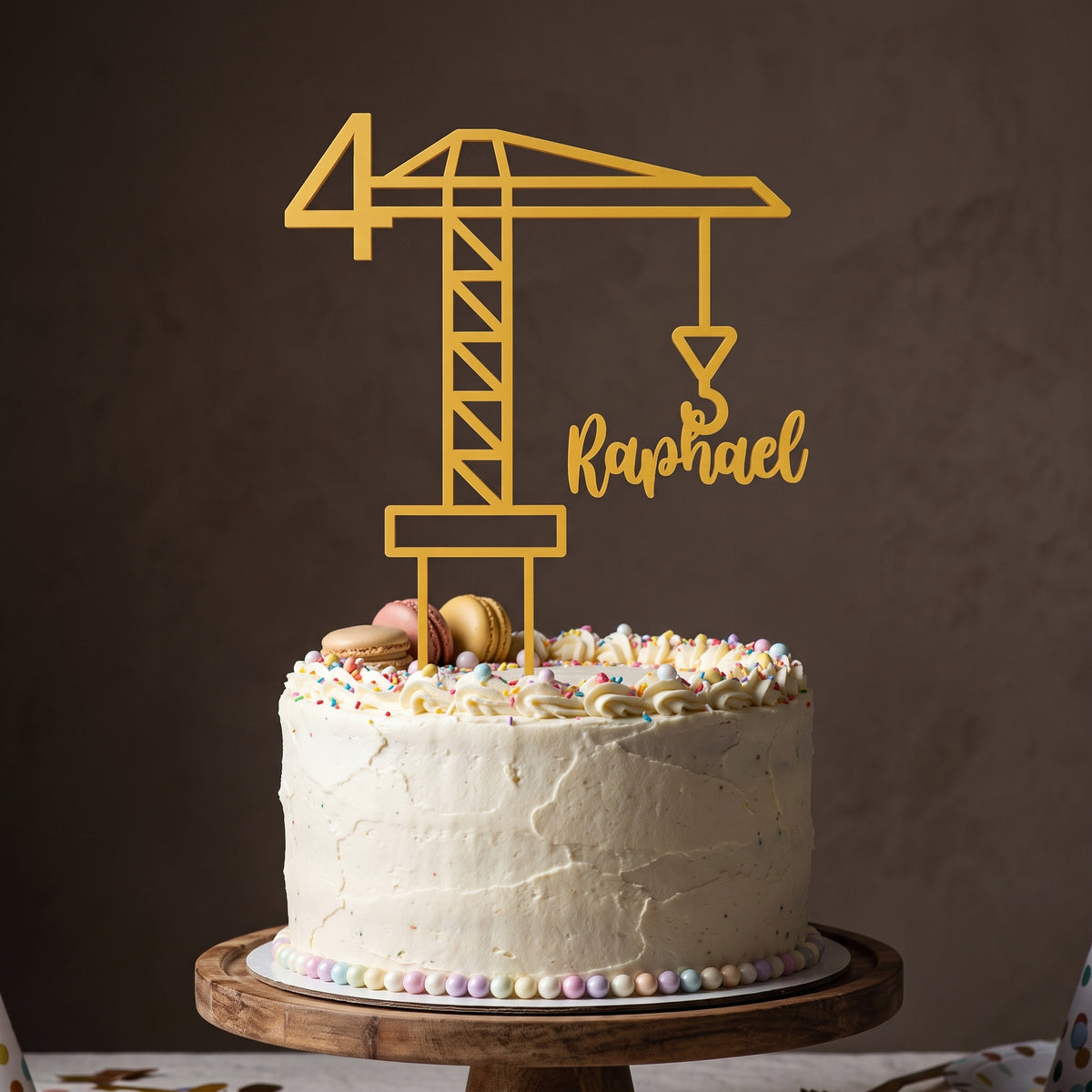 Cake Topper Kran in Gold auf festlicher Torte